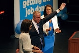 Premier Colin Barnett arrives onstage at the Liberal party election campaign launch with Liza Harvey.