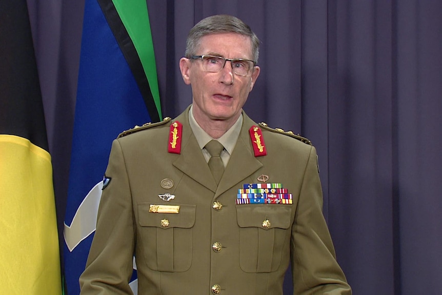 Chief of Defence Angus Campbell  addresses the media while wearing his uniform