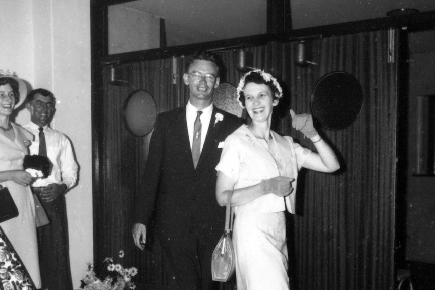 A black and white photo of a woman and a man dancing.