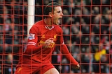 Jordan Henderson celebrates a goal for Liverpool against Swansea
