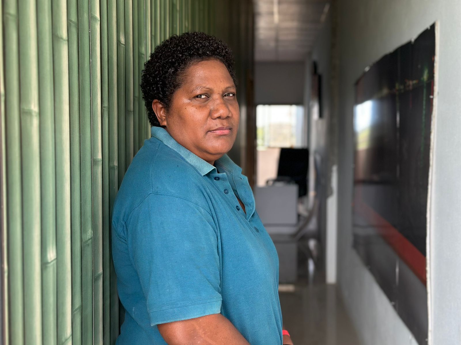 A solomon islander looking back at the camera with a pensive expression 