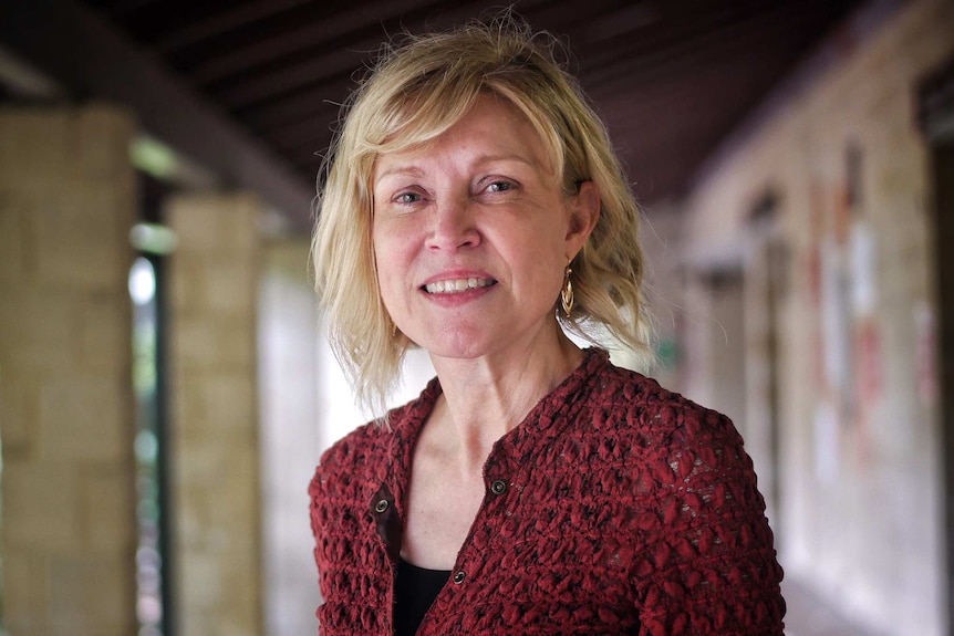 Headshot of a woman smiling at the camera.