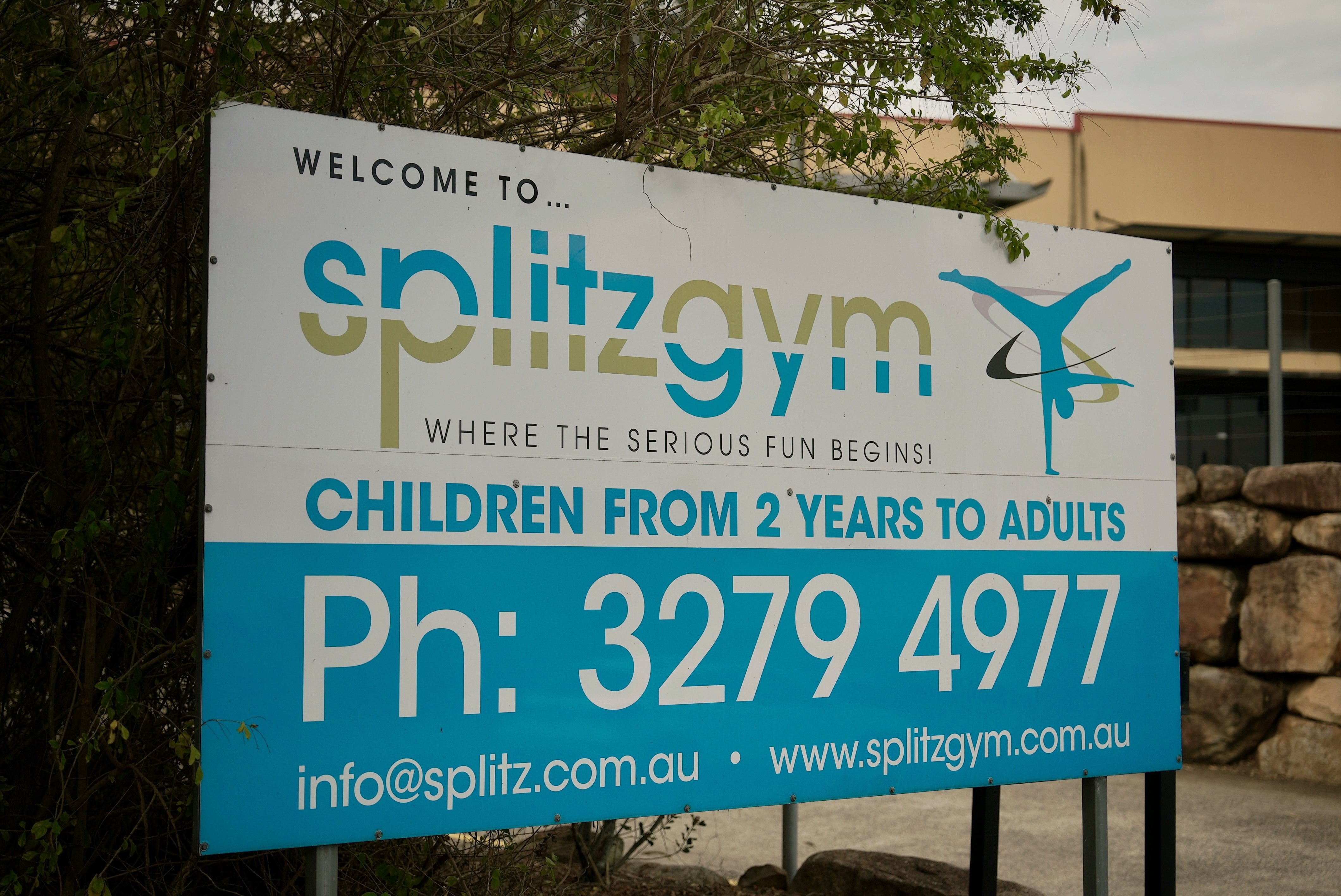 an image of a white sign advertising splitz gym in brisbane
