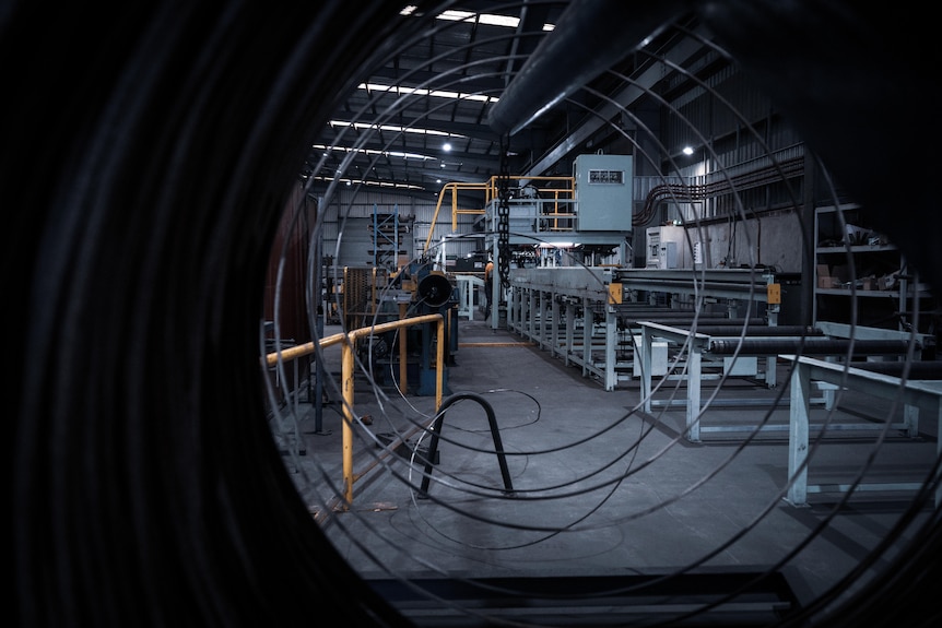 A large factory floor with machinery.