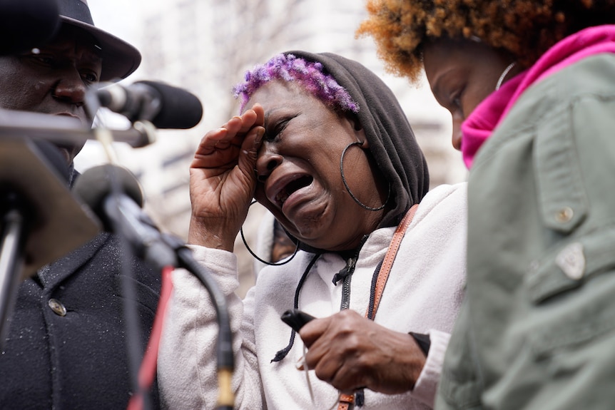 Angie Golson, grandmother of Daunte Wright, cries as she speaks during a news conference.