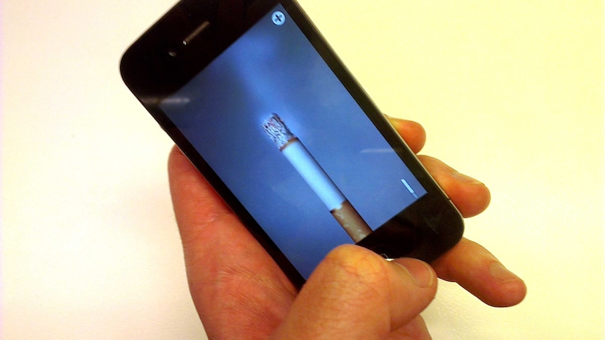 A person uses a smoking app on their Smartphone.