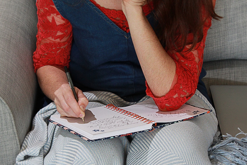 Emma Bosworth working on song lyrics in Townsville.