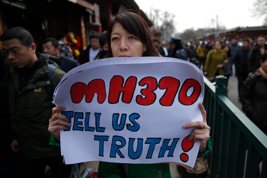 Families of passengers onboard missing flight MH370 remember one year on