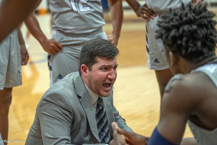 Bill Morosco on basketball court instructing team