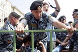 Policemen detain an activist during a gay rights protest in Moscow