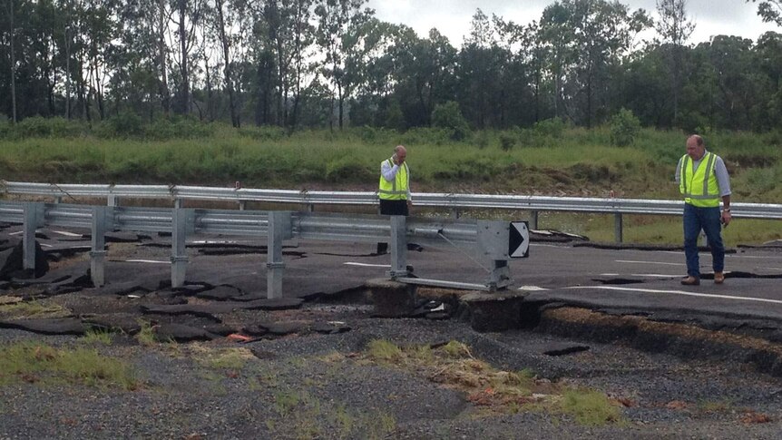 Flood-damaged road crossing at Yeppoon, north of Rockhampton in central Queensland on March 27, 2014