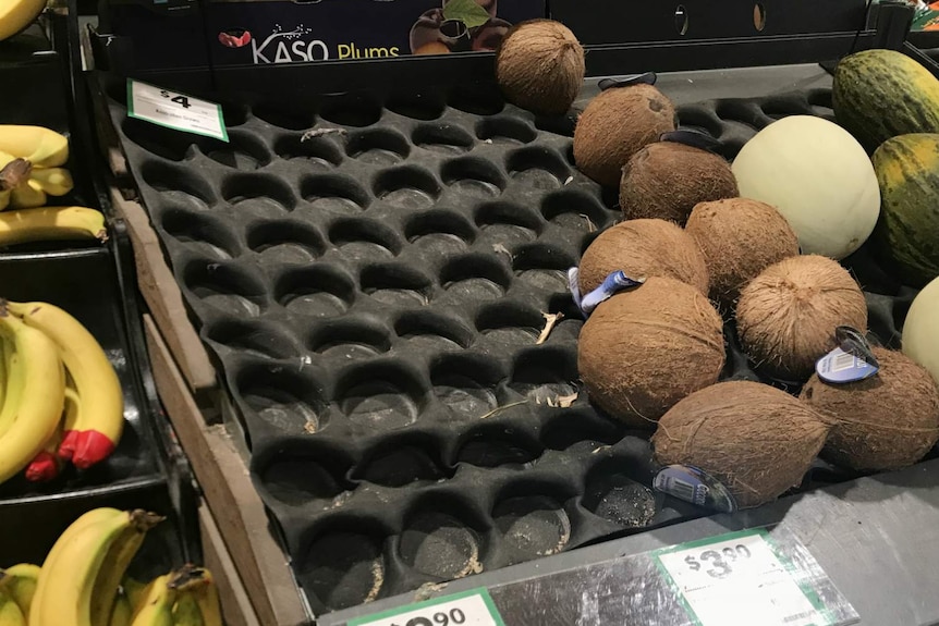 A bare supermarket shelf.