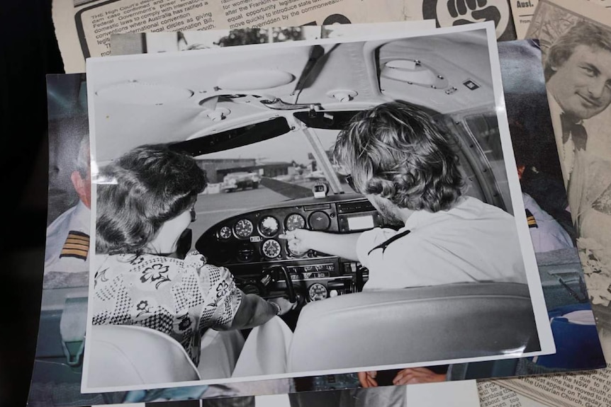 Two people sat in a plane cockpit