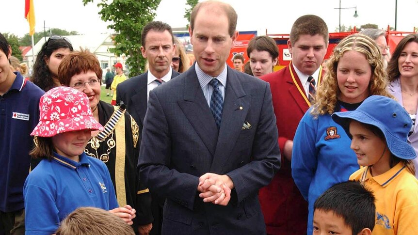 The Earl of Wessex, Prince Edward, chats with students playing chess at a Youth Expo in Williamstown.