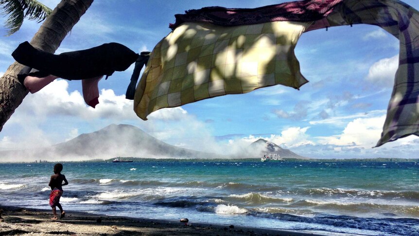 On the road to Rabaul two volatile volcanoes continue to spew ash on to the former provincial capital Rabaul.