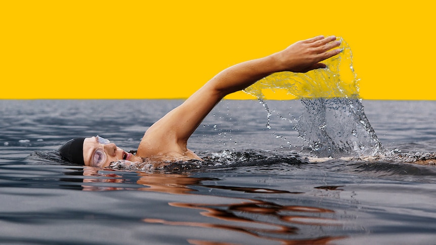 Woman swimming in the ocean.