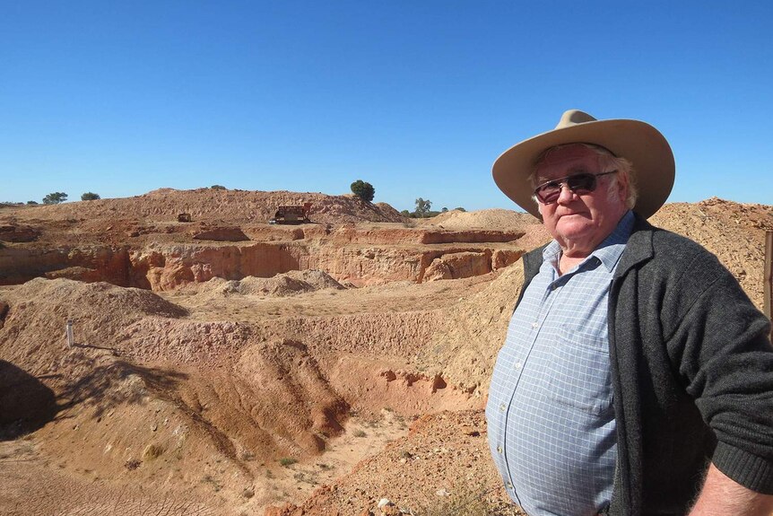 Raleigh Henderson, from the Yowah opal miners group, at an open cut pit in western Qld in July 2014