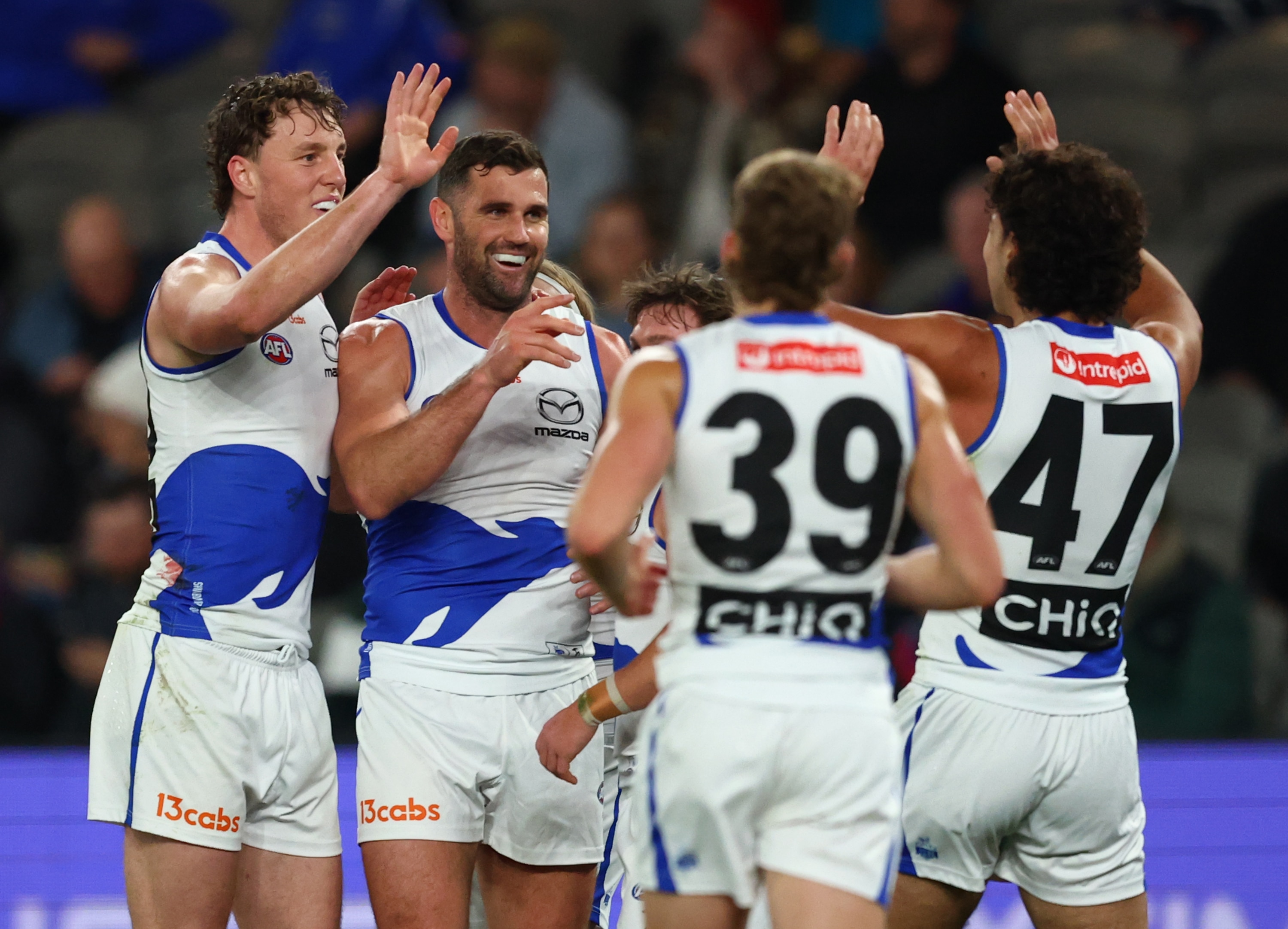 Live: Roos rattle Dogs early as AFL's response to Geelong saga causes confusion