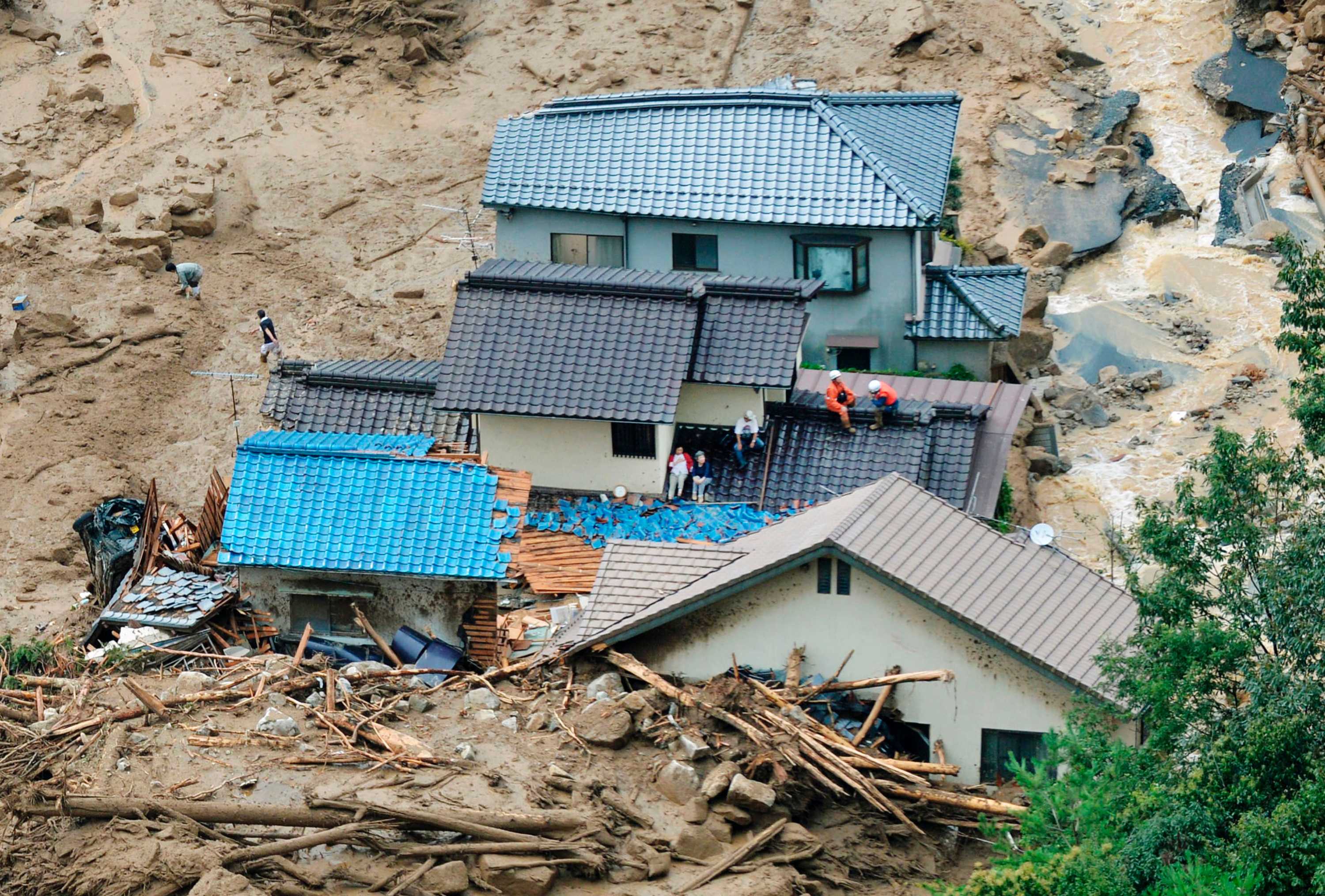japan-landslide-at-least-39-people-dead-more-missing-as-homes-are