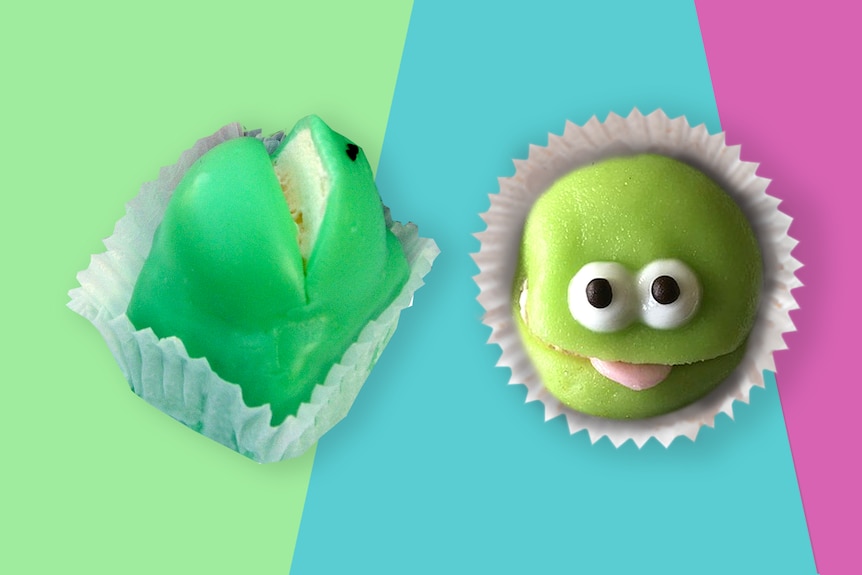 Image of two cupcakes, from the front and side, with green icing, a slit in the top like a mouth and eyes drawn on like a frog.