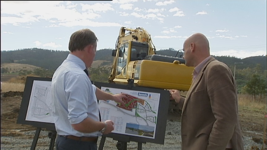 Will Hodgman looks over building plans with developer Rob Lynch.