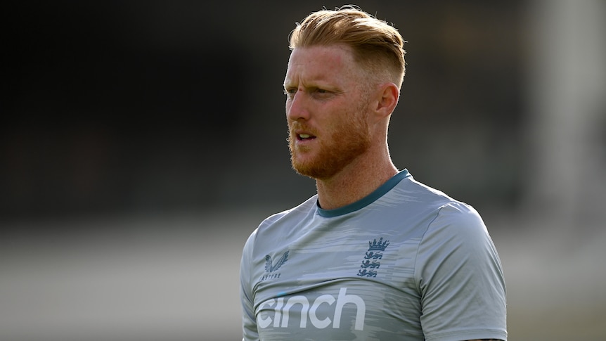A stern-faced England cricket captain stares into the distance at a training session.