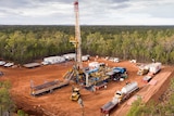 A drilling rig in a clearing.