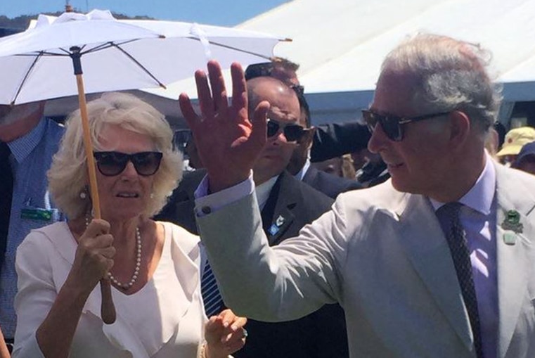 Prince Charles waves while his wife Camilla holds a parasol at the Albany Agricultural Show.