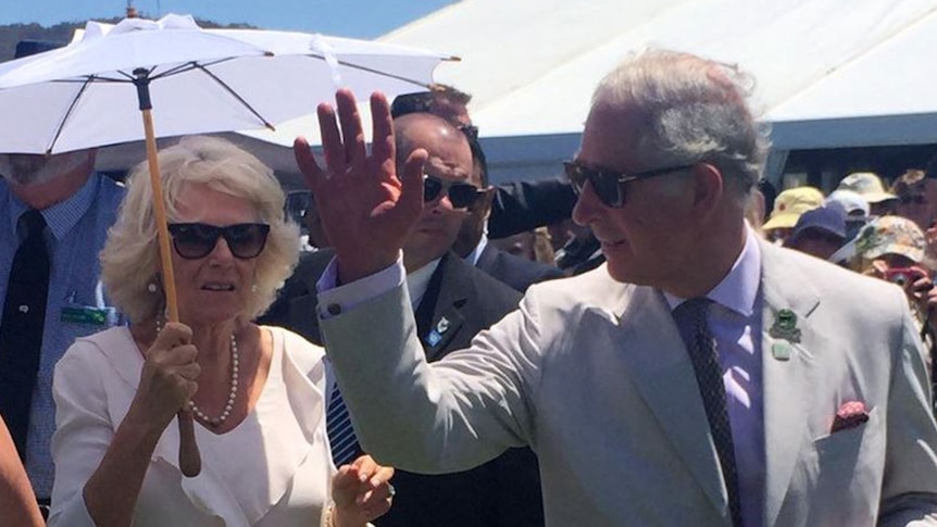 Prince Charles waves while his wife Camilla holds a parasol at the Albany Agricultural Show.