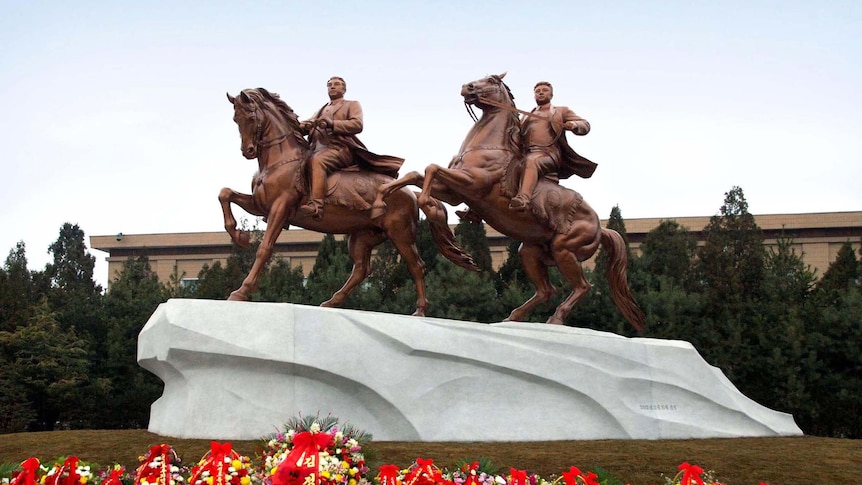 Statues of former North Korean president Kim Il Sung (left) and late leader Kim Jong Il