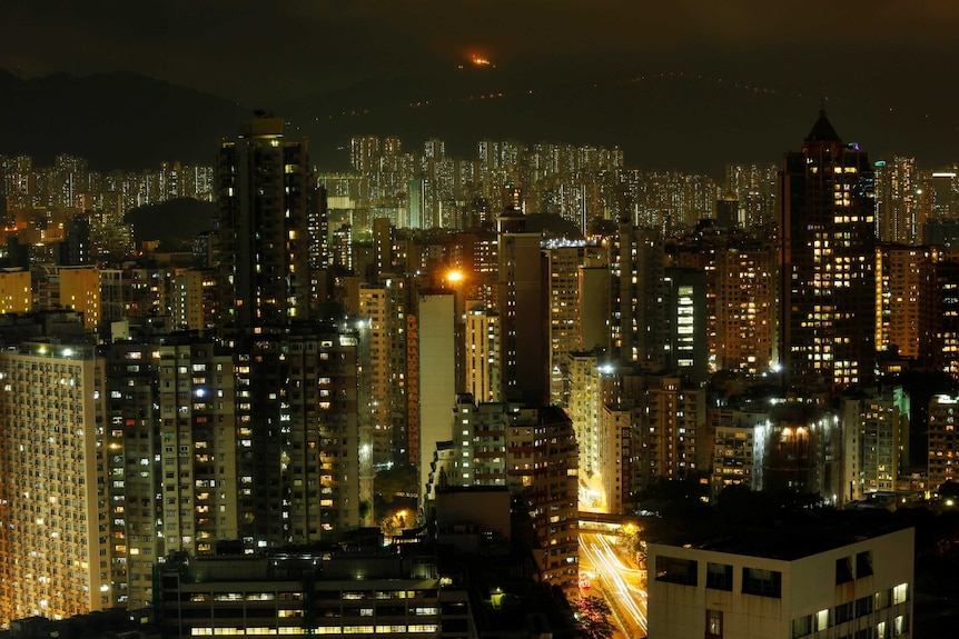 Hong Kong high rise apartments lit up at night