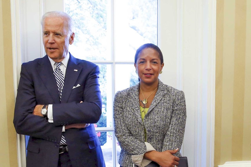 Joe Biden and Susan Rice standing next to each other in the Oval Office