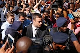 Oscar Pistorius arrives for his sentencing