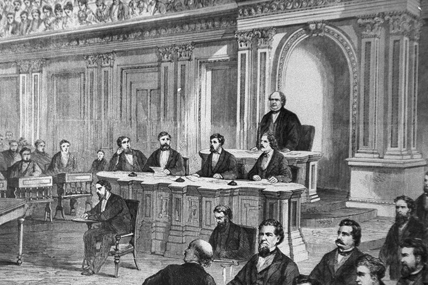 A black and white drawing of the Senate impeachment trial of Andrew Johnson. There is a table of executives facing the room.