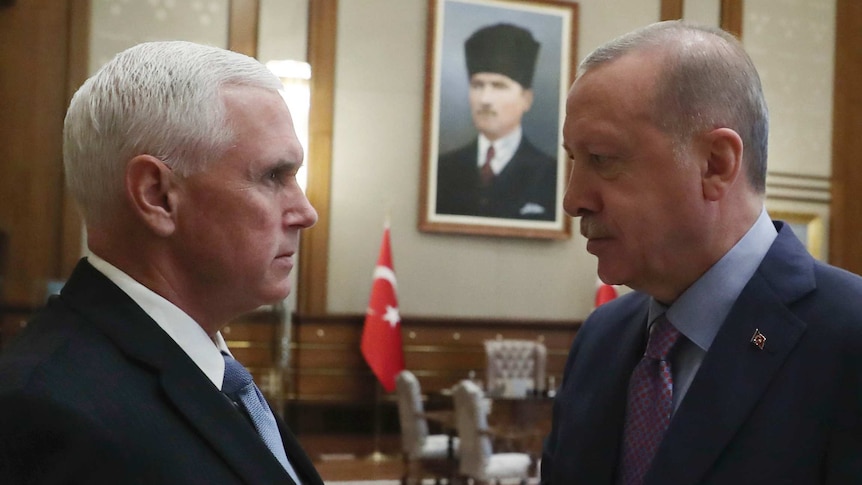 Mike Pence and Turkish President Recep Tayyip Erdogan shake hands.