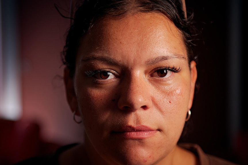 A close up of a woman looking serious.