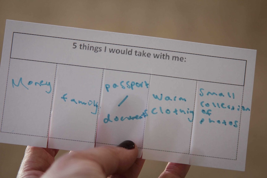 A piece of paper with five boxes for participants to write the five things they'd take with them in fleeing their home.