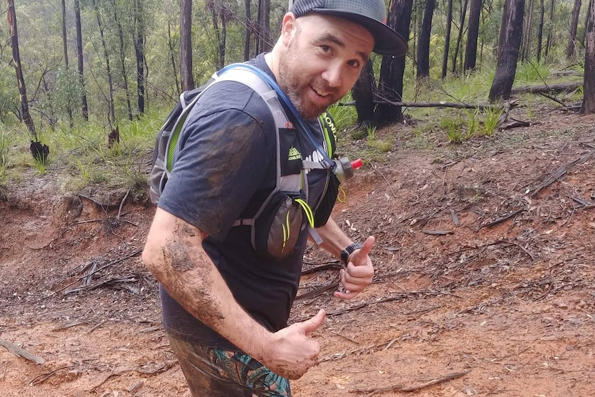 Man with his thumbs up training for a marathon in the Blue Mountains