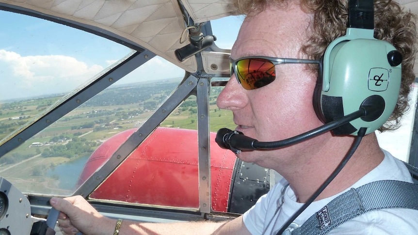 Andrew Myers, flying a plane, who has a hearing disability has lodged a disability discrimination case against BHP Billiton and Carey Mining