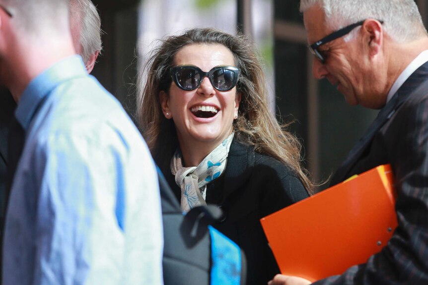 Kathy Jackson smiles as she arrives at the Melbourne Magistrates' Court.