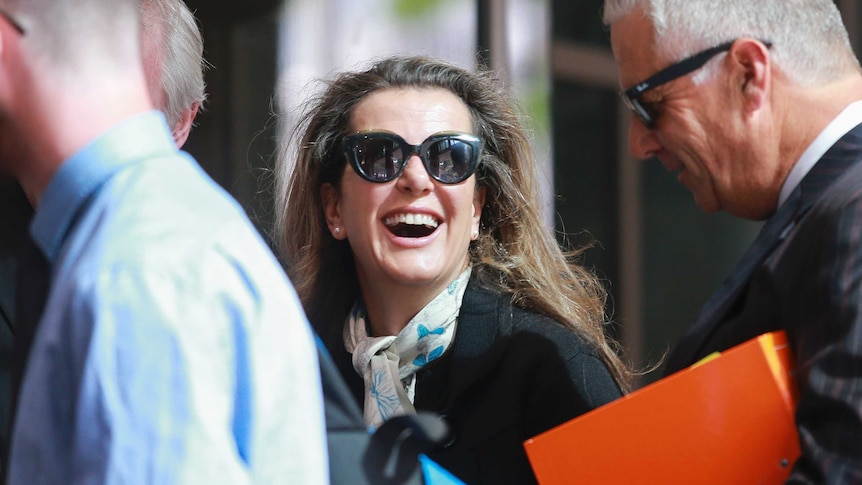 Kathy Jackson smiles as she arrives at the Melbourne Magistrates' Court.