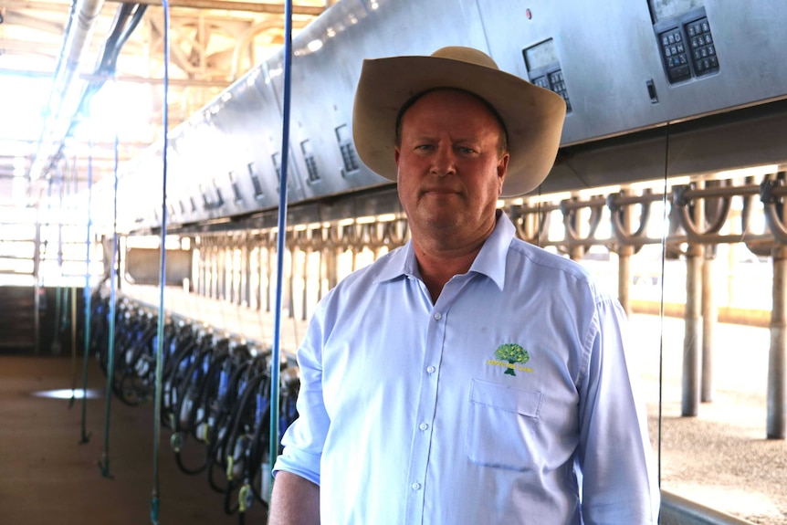 David McNamee stands in his empty dairy a month after shutting it down.