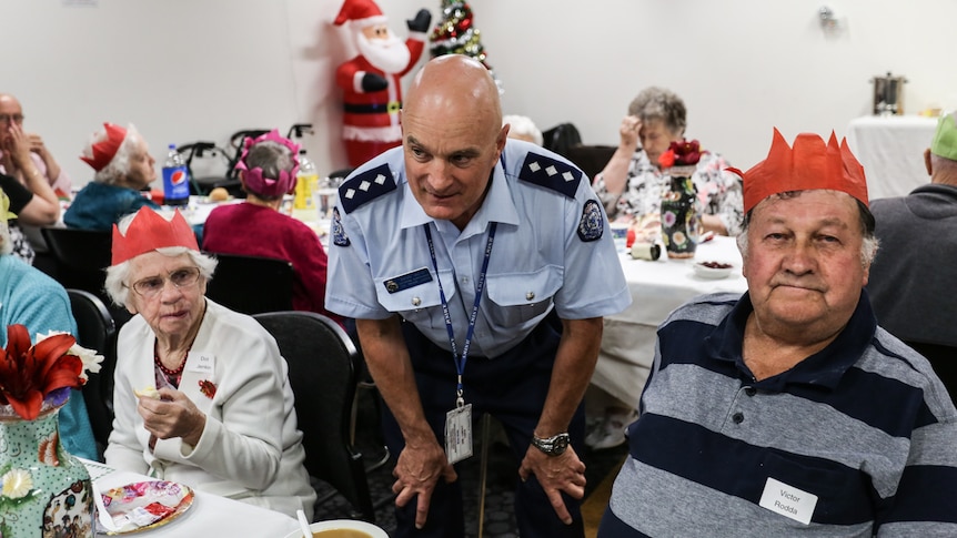 Catering supervisor at Middleton Prison, Brian Smith talking to some senior citizens.