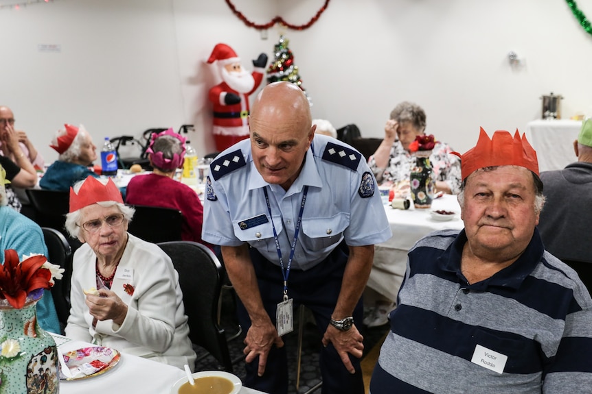 Catering supervisor at Middleton Prison, Brian Smith talking to some senior citizens.