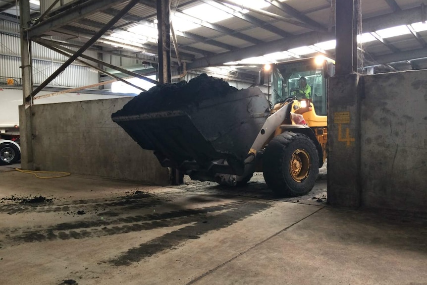 A truck with a load of biosolids.