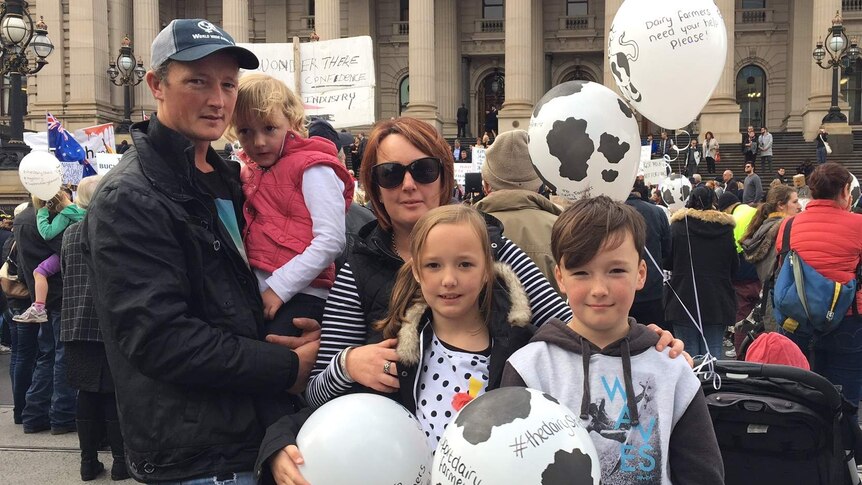 Dairy farmer family on the steps of the Victoria Parliament at a protest rally