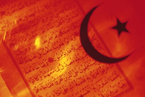 Creative: Islamic symbol over Koran (Thinkstock: Comstock)