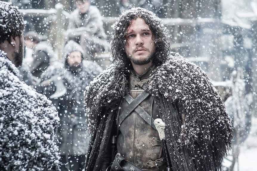 Game of Thrones character Jon Snow covered in snow