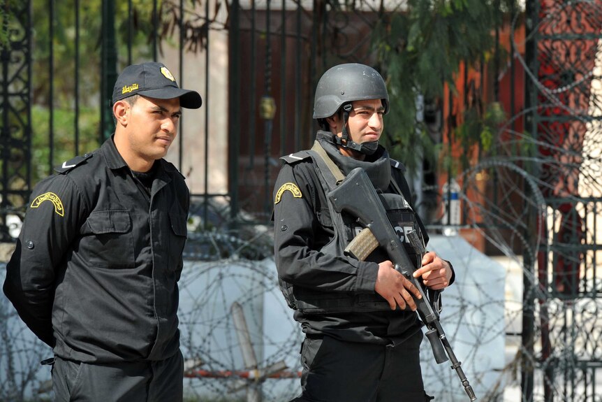 Tunisian security forces stand guard outside Bardo Museum