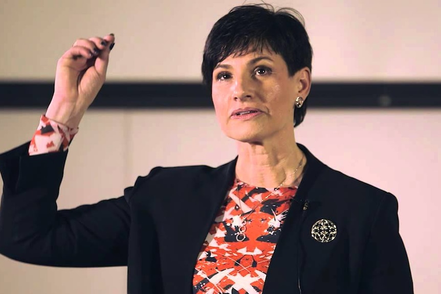 Head and neck cancer surgeon Elizabeth Sigston gestures during a talk